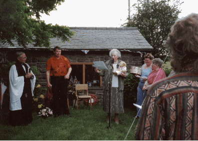  ROSEMARY RIGBY RECEIVES A GIFT OF VIOLETTE THE BEAR FROM GILL AND WENDY OF BEAR SQUADRON 